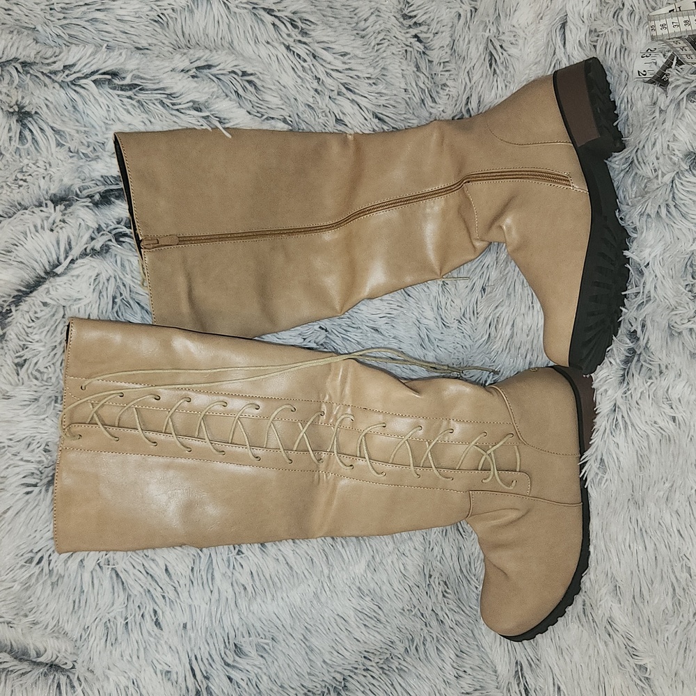 Tan 1 and 1/4" heel, zip up with laces boots